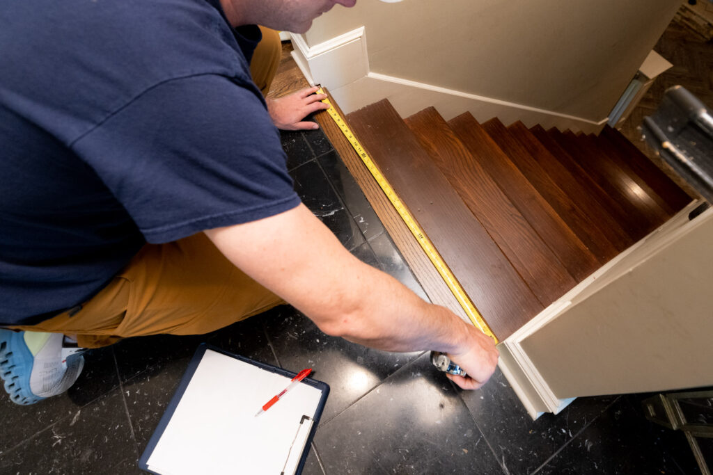 man measures staircase
